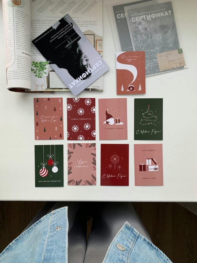 Collection of holiday greeting cards with festive designs and decor, perfect for seasonal cheer.