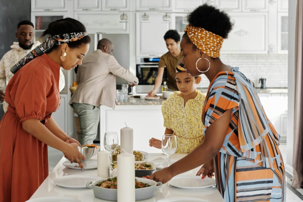 A family enjoying a meal together in a stylishly decorated kitchen setting.